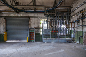 Interior view of open old dirty room with the controller zone of pressure sensors, pump station and...