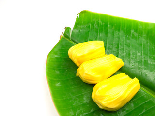 Yellow jackfruit  on banana leaf, isolated on white background
