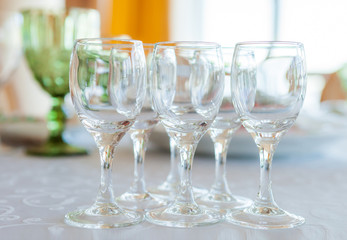 Glasses on a laid served wedding table, close-up