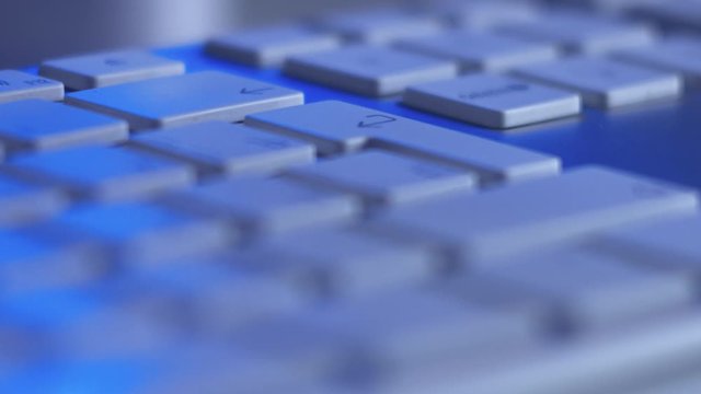Close Up Of Editing Text Process Or Sending Message Via Internet in Monitor Blue Light. Macro shot.