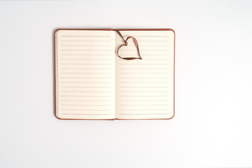 top view blank orange leather diary on white desk