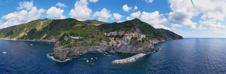 Fototapeta premium Panorama view of Manarola village one of Cinque Terre in La Spezia, Italy. Flight by a drone.