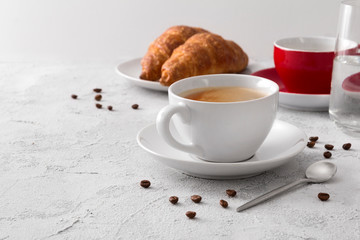 Breakfast with hot delicious coffee and croissants