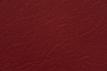 Abstract red wrinkled paper texture background or backdrop. Empty old crumpled parchment for decorative design element. Stained cardboard surface for christmas holiday or Chinese new year concept
