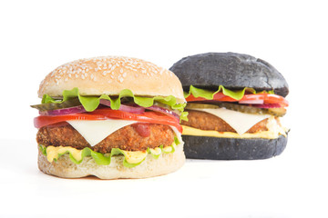 Delicious fast food. Two delicious burgers black and white, isolated on white background