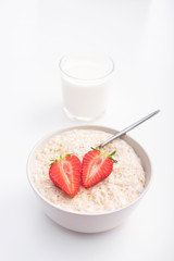 Sweet porridge with red strawberry