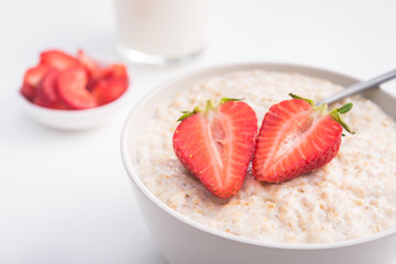 Sweet porridge with red strawberry