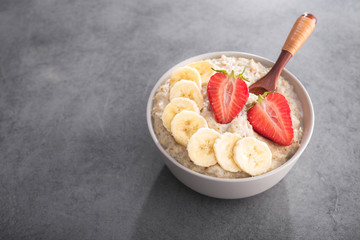Oatmeal bowl  with banana and strawberry