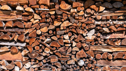 Large pile of sawn wood in different sizes and shapes