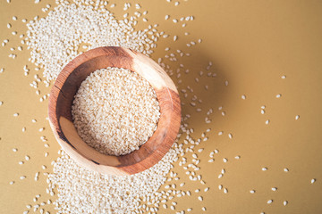 Sesame seeds isolated in bowl, top view - obrazy, fototapety, plakaty