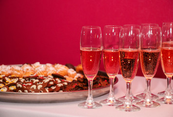 glasses of champagne with biscuits at the celebration
