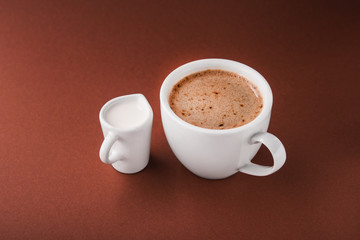 Obraz premium Coffee cup with milk carafe