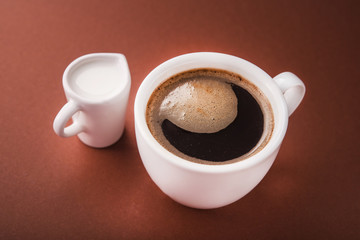 Coffee cup with milk carafe