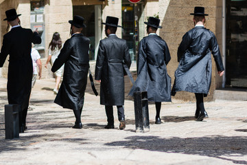 A group of Ultra Orthodox Jews walking on the street of the Old city of Jerusalem