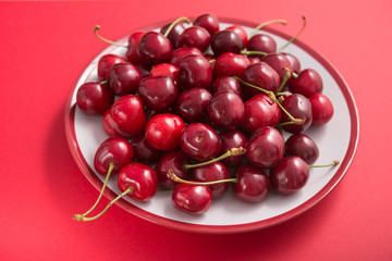 Sweet fresh cherries fruit on a plate