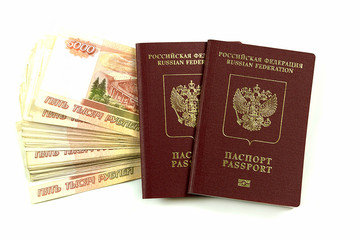 Two Russian passports with denominations of five thousand rubles. Traveling abroad during your vacation.