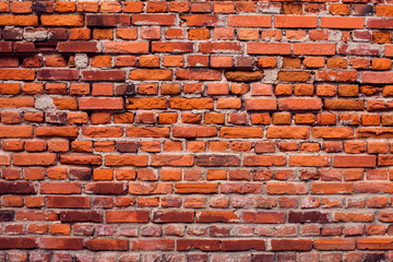 Naklejka premium Red bricks wall background. Old building surface