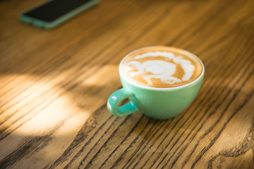 Italian cafe, turquoise color of cappuccino coffee cup