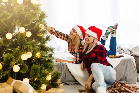 Two Girlfriends Exchanging Christmas Presents