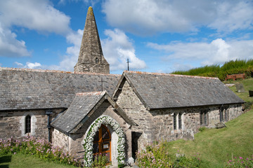 Fototapeta na wymiar Late norman English church with flower arch for wedding