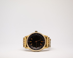 Gold watch on a white background