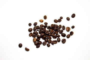 Dark brown coffee beans on a white background