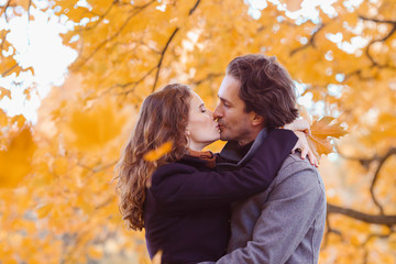 Fototapeta premium Couple kissing in autumn park