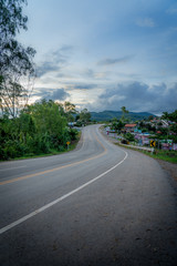 Fototapeta na wymiar Long empty rural highway road beautiful summer day, Khao Kho Phetchabun Province, THAILAND 