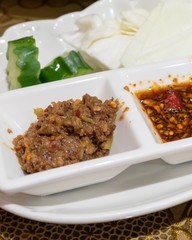 Burmese fermented dipping sauces in dip bowls