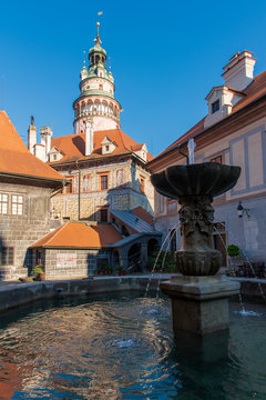 view of castle Krumlov with fountain