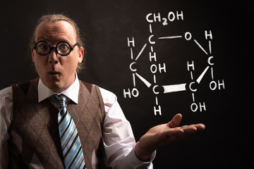 Professor presenting handdrawn chemical formula of glucose