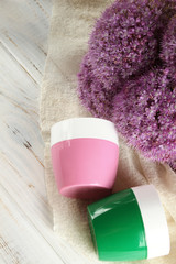 Two cans of cosmetic cream