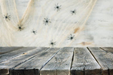 holidays concept of Halloween background with empty rustic table. Ready for product display montage.