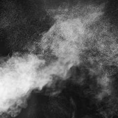 Bright steam on a dark square background