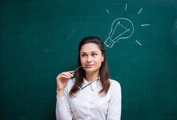 young teacher comes up with an idea near the board