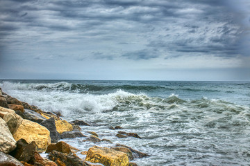  Waves crashing against the rocks by the beach