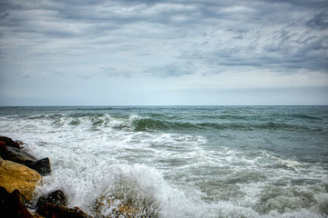  Waves crashing against the rocks by the beach