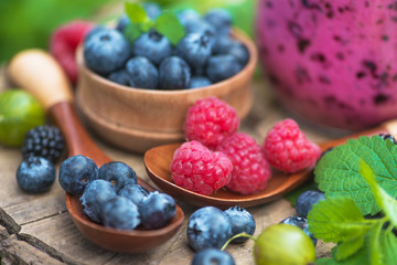 Homemade bottle with blueberry, raspberry, gooseberry smoothie and berry