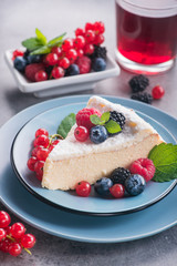 Sweet dessert cake with fresh blackberry, raspberry, currants and blueberry