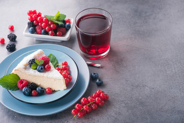 Sweet dessert cake with fresh blackberry, raspberry, currants and blueberry
