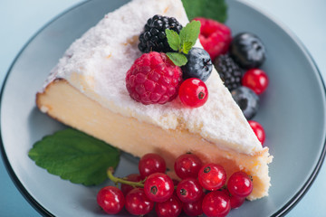 Sweet dessert cake with fresh blackberry, raspberry, currants and blueberry