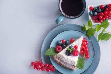 Sweet dessert cake with fresh blackberry, raspberry, currants and blueberry