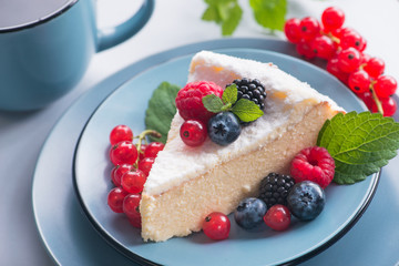 Sweet dessert cake with fresh blackberry, raspberry, currants and blueberry