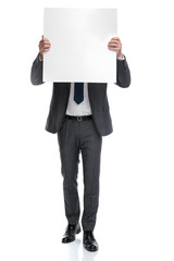 businessman covers his head with a blank board