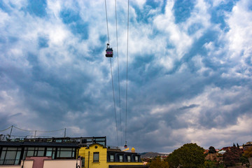 Cableway in Tbilisi. Passenger cabins against the sky