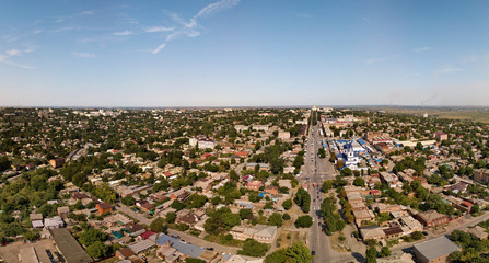 Provincial city in southern Russia on a summer sunny day - small houses, lots of green drone view, aerial view 