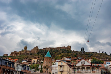 The historical part of the city of Tbilisi. Cableway on sky background