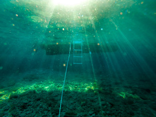 Underwater view of the anchored tourist boat