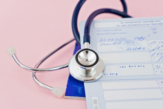 Stethoscope and pet passport with stamps about vaccinations. Concept of preparing pet for travel