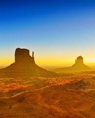 Fototapeta na wymiar View of Monument Valley at sunrise near the border of Arizona and Utah in Navajo Nation Reservation in USA.